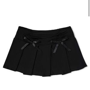 NWT SPENCERS BODY RAGE BOW MINI SKIRT SIZE SMALL/MEDIUM